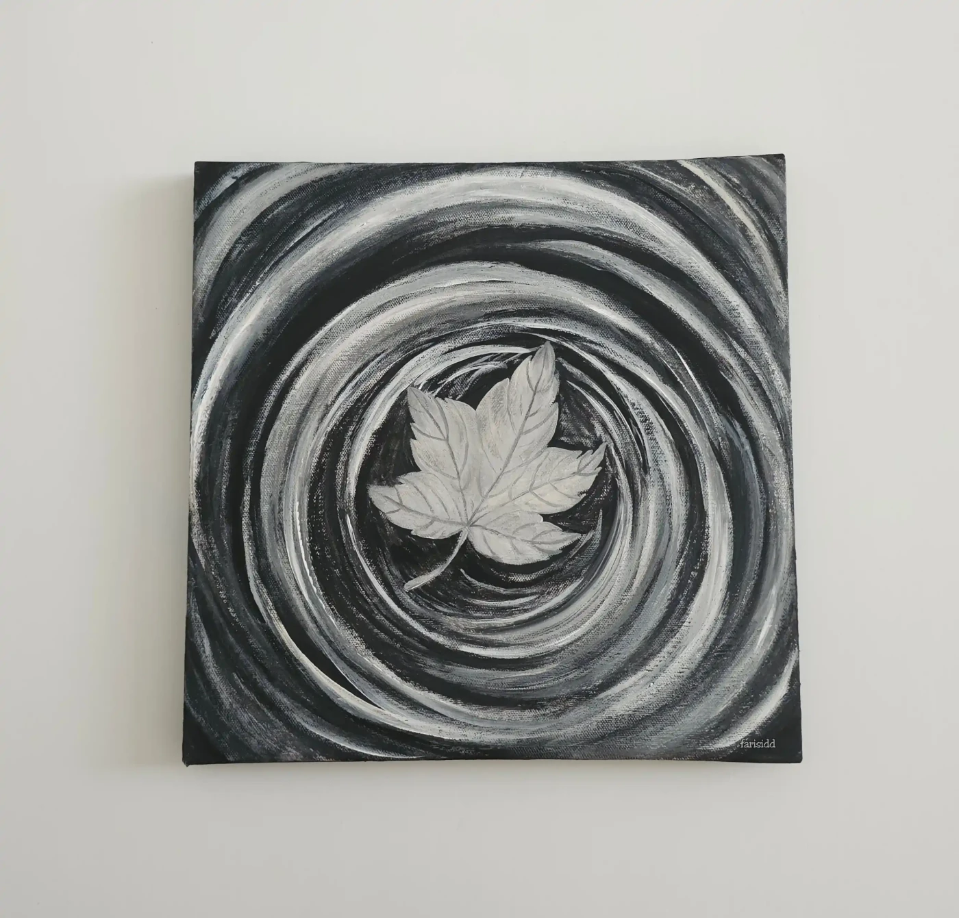 Monochrome Ripple: A Leaf’s Journey